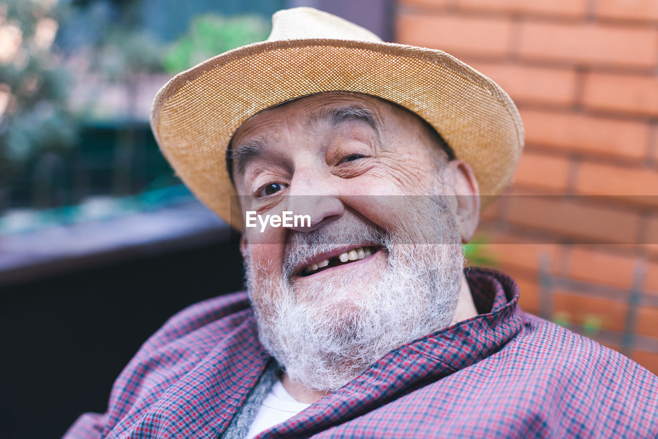 Smiling elderly man with missing tooth