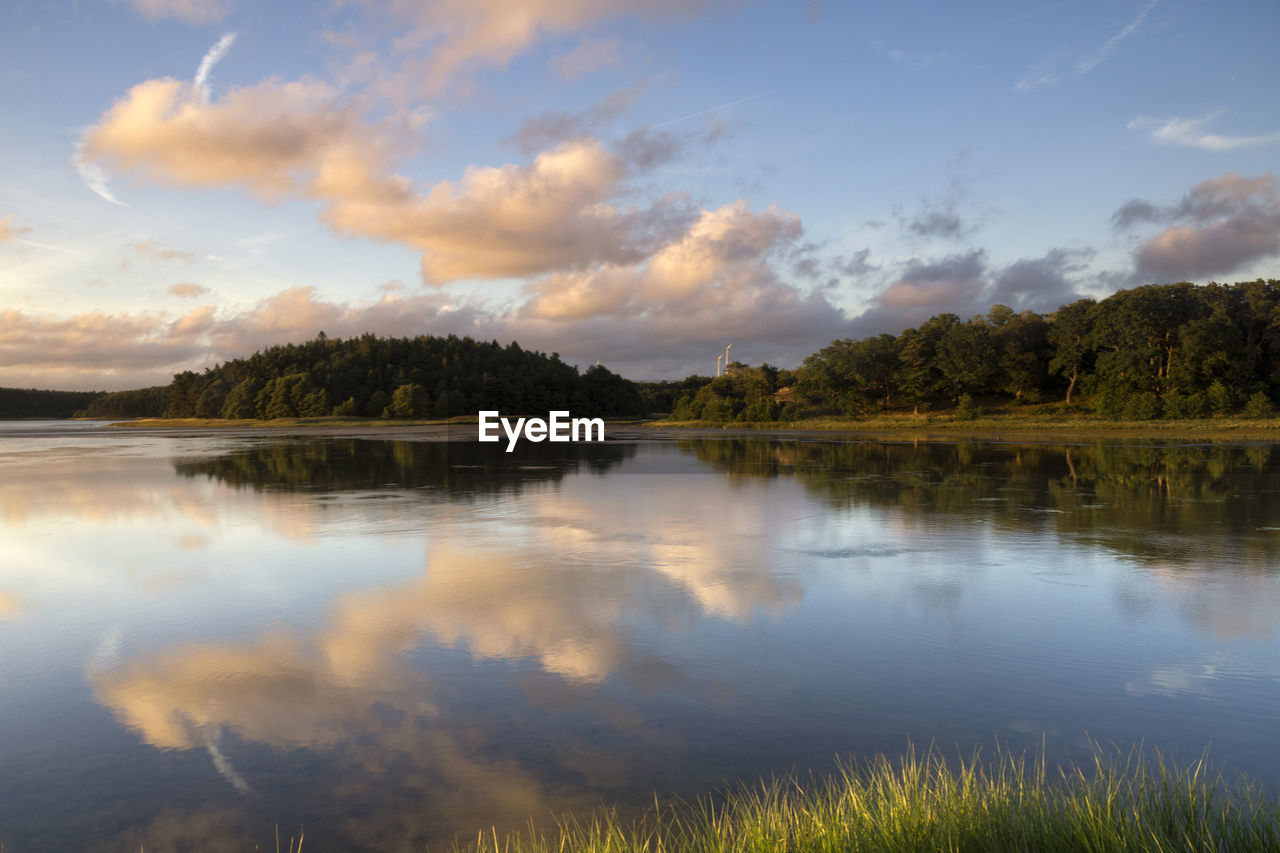 Scenic view of lake against sky during sunset