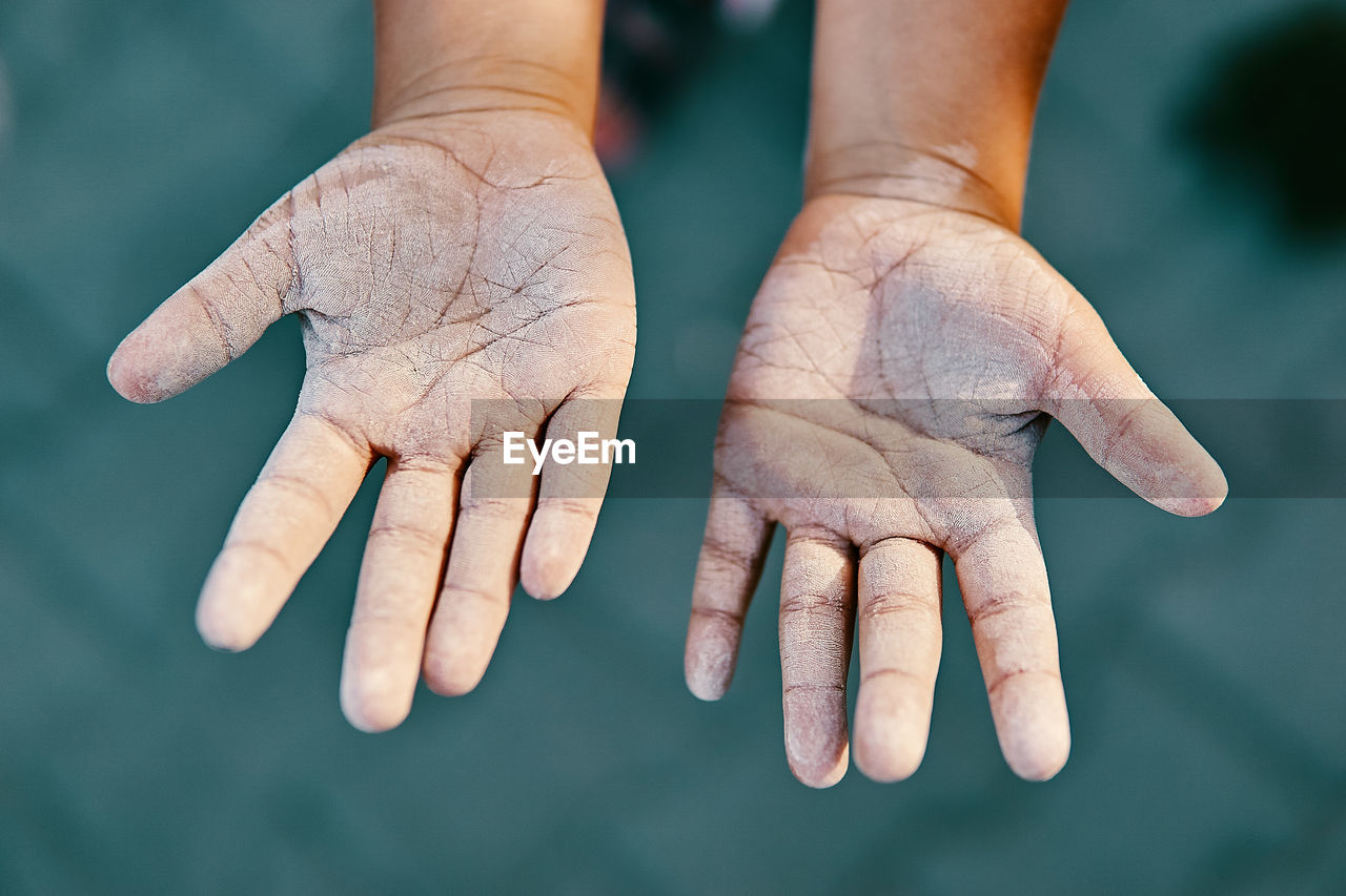 Cropped image of dirty hands