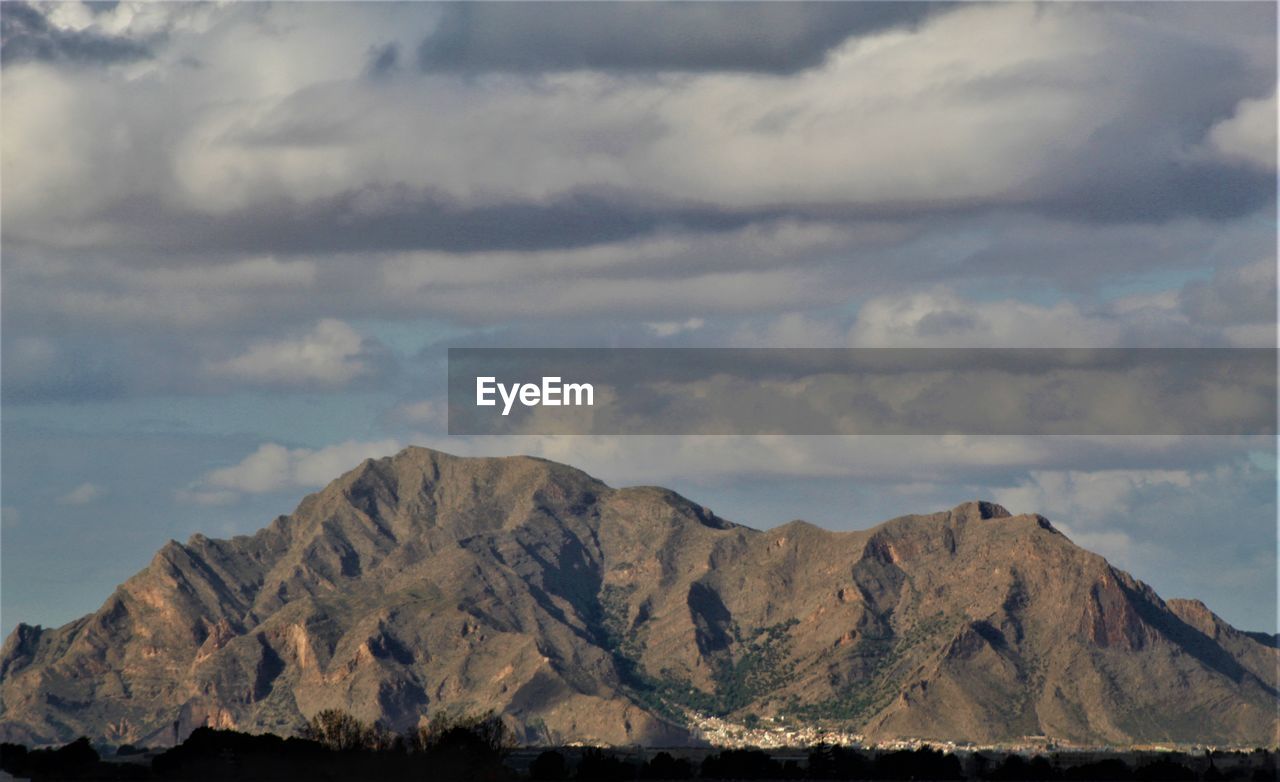 mountain, cloud, sky, environment, scenics - nature, landscape, nature, mountain range, beauty in nature, horizon, rock, no people, land, outdoors, travel destinations, panoramic, tranquility, plateau, tranquil scene, day, travel, water, mountain peak, snow