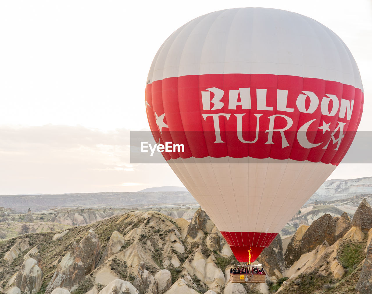 VIEW OF HOT AIR BALLOONS ON LANDSCAPE