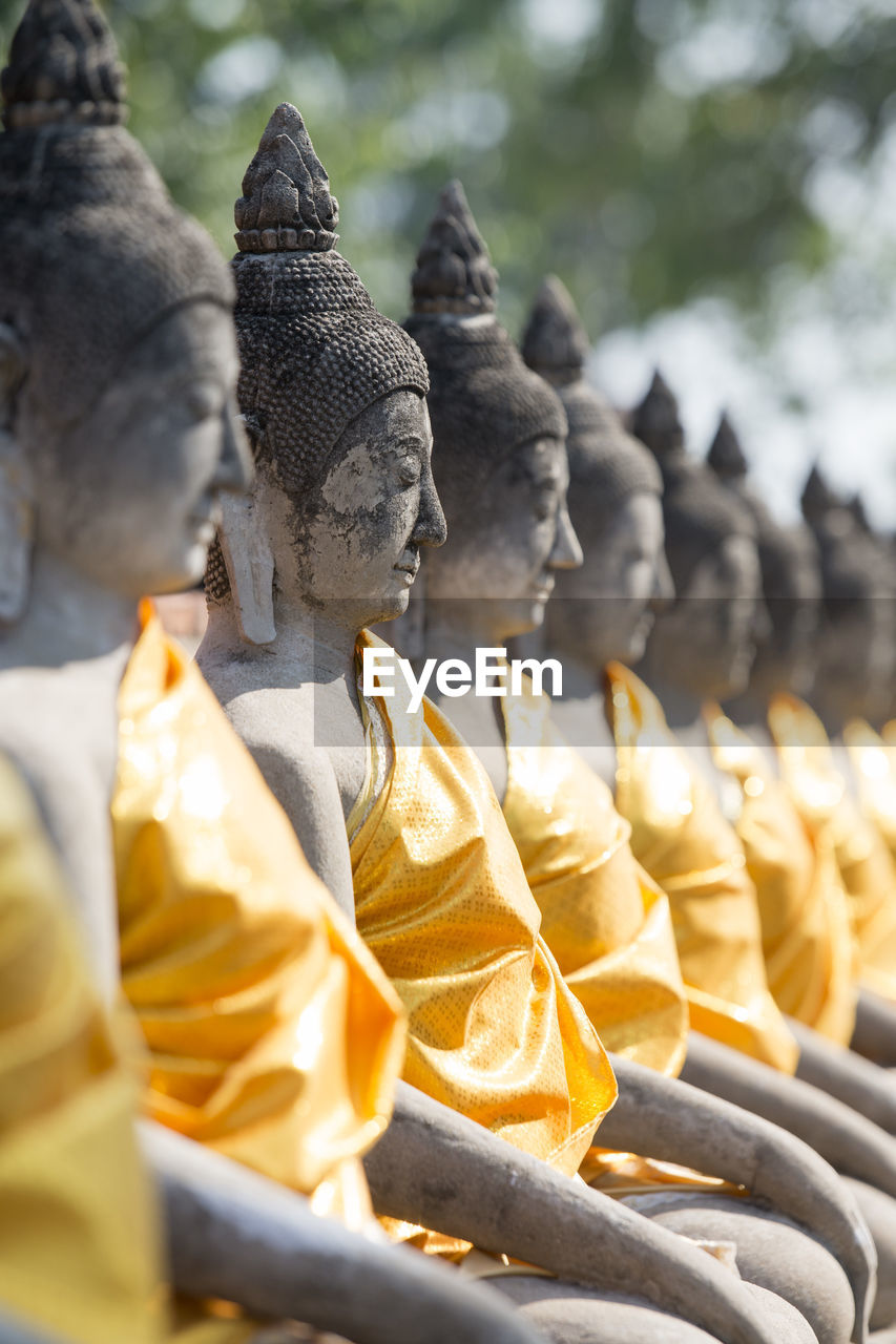 Buddha statues in row at wat yai chai mongkhon