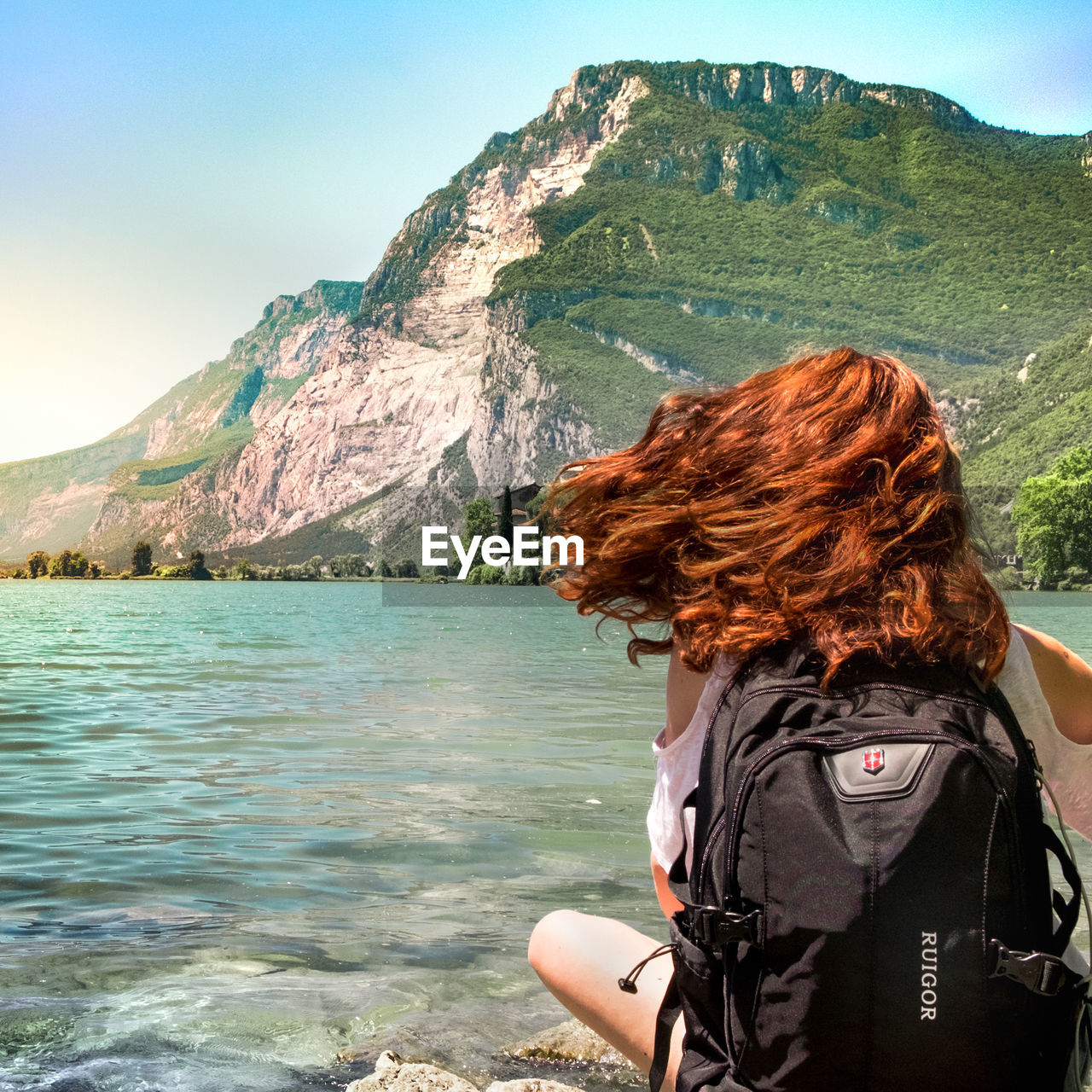 REAR VIEW OF WOMAN LOOKING AT VIEW OF MOUNTAIN