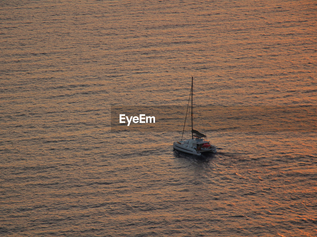 High angle view of sailboat sailing on sea