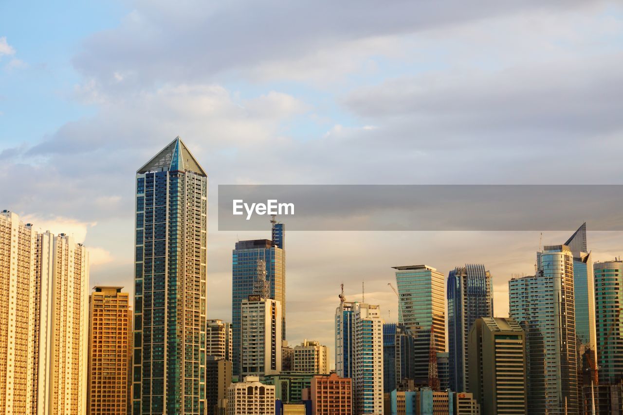 Skyscrapers in city against sky