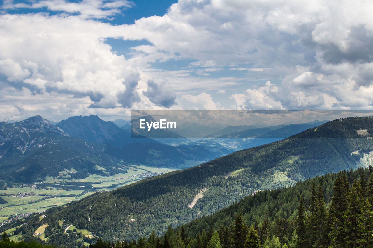 Scenic view of mountains against cloudy sky