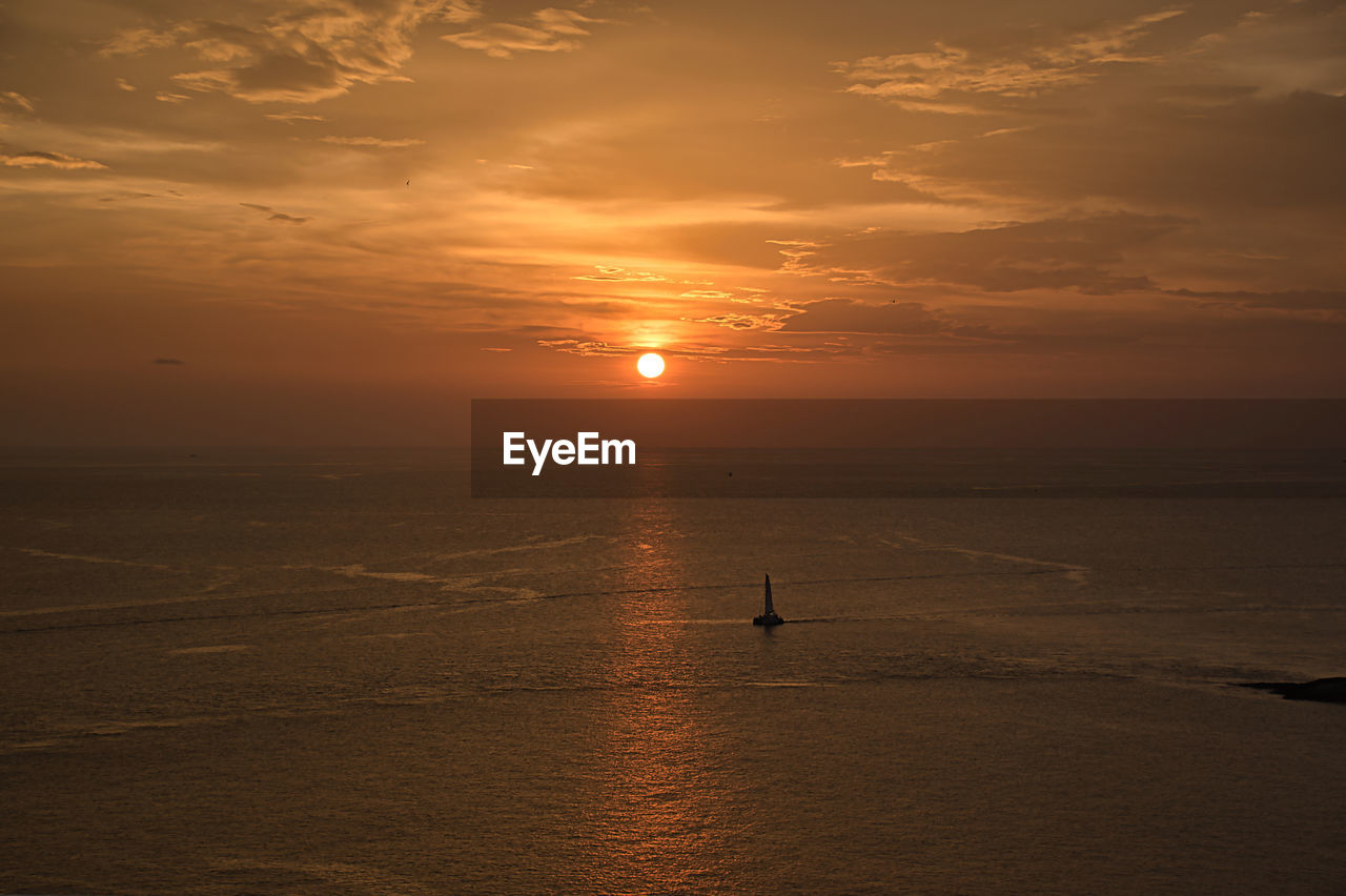 SCENIC VIEW OF SEA DURING SUNSET