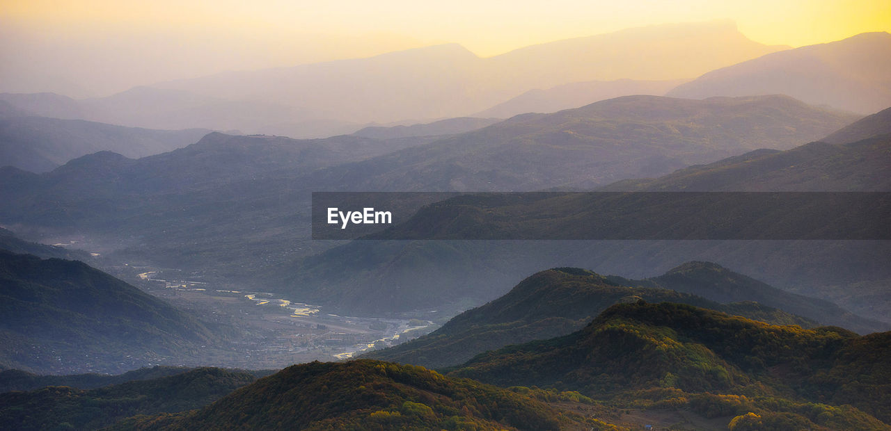 Scenic view of mountains against sky during sunset