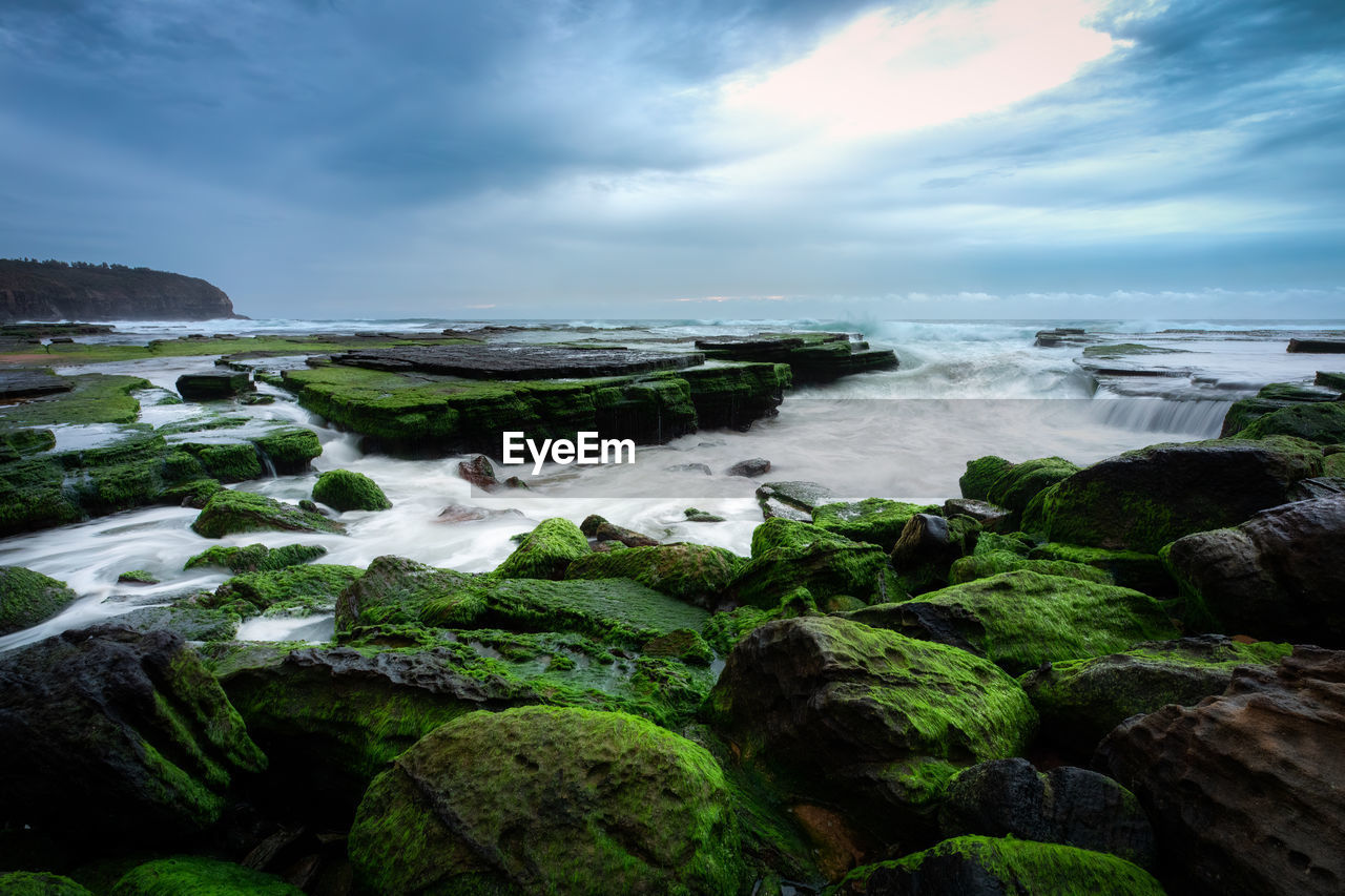 scenic view of sea against cloudy sky