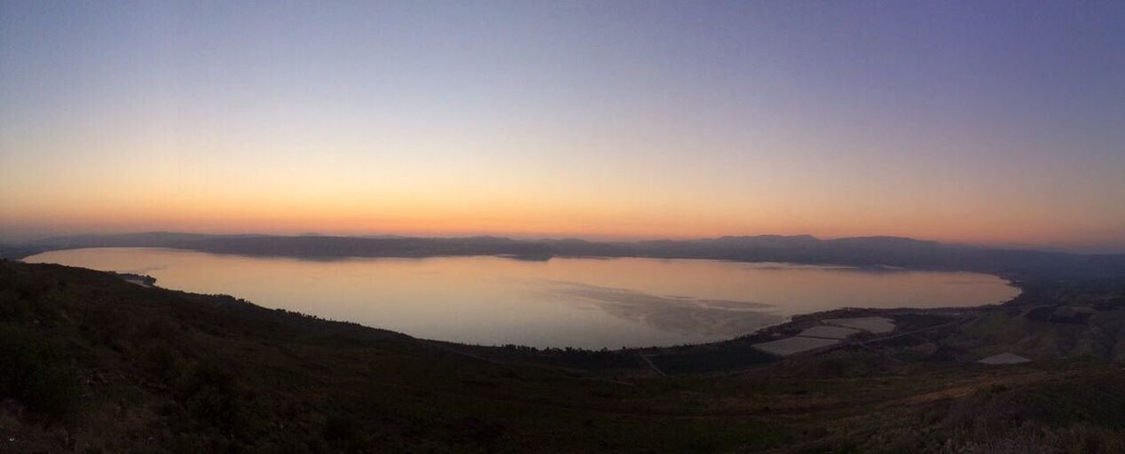 Panoramic view of lake against clear sky at sunset