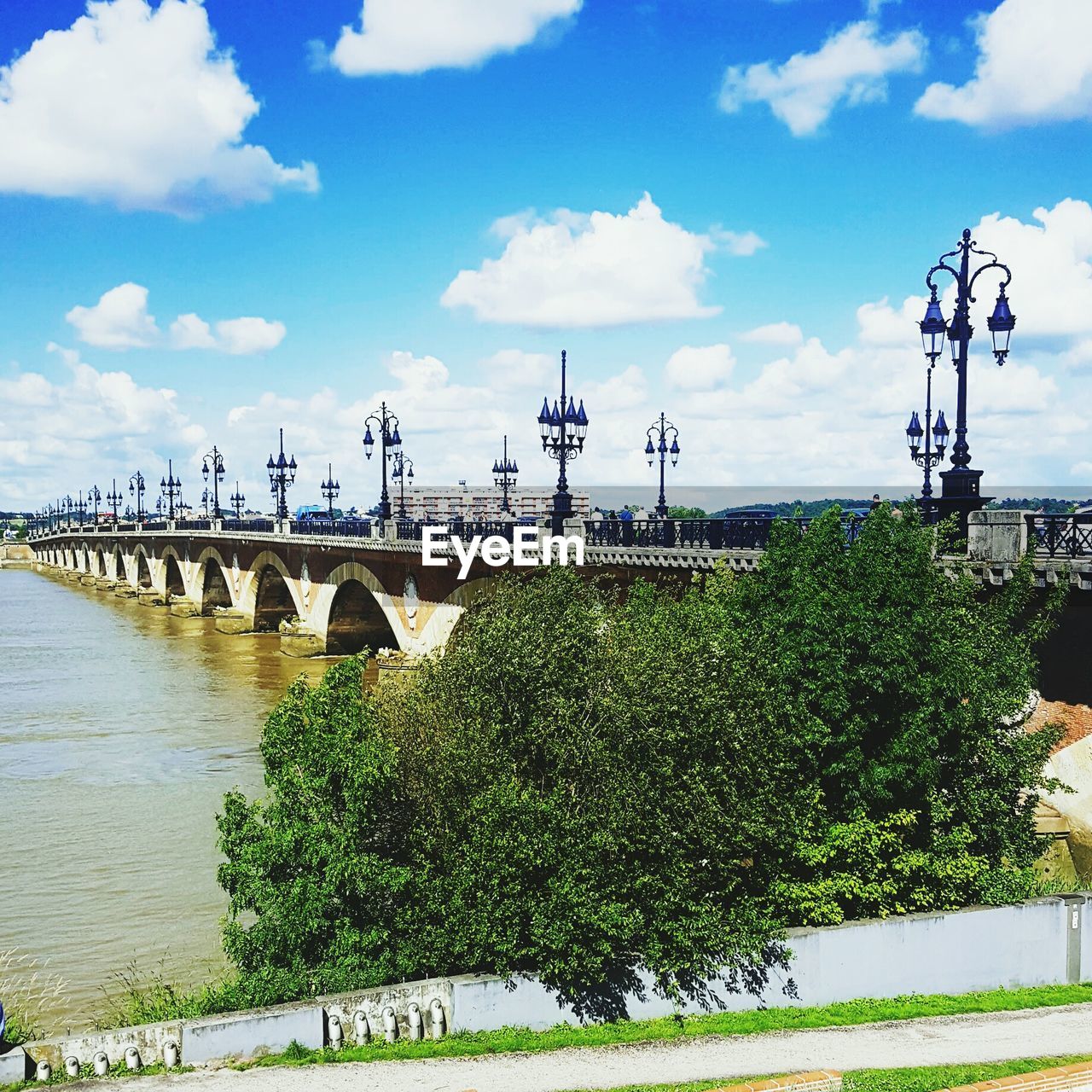 VIEW OF RIVER AGAINST CLOUDY SKY