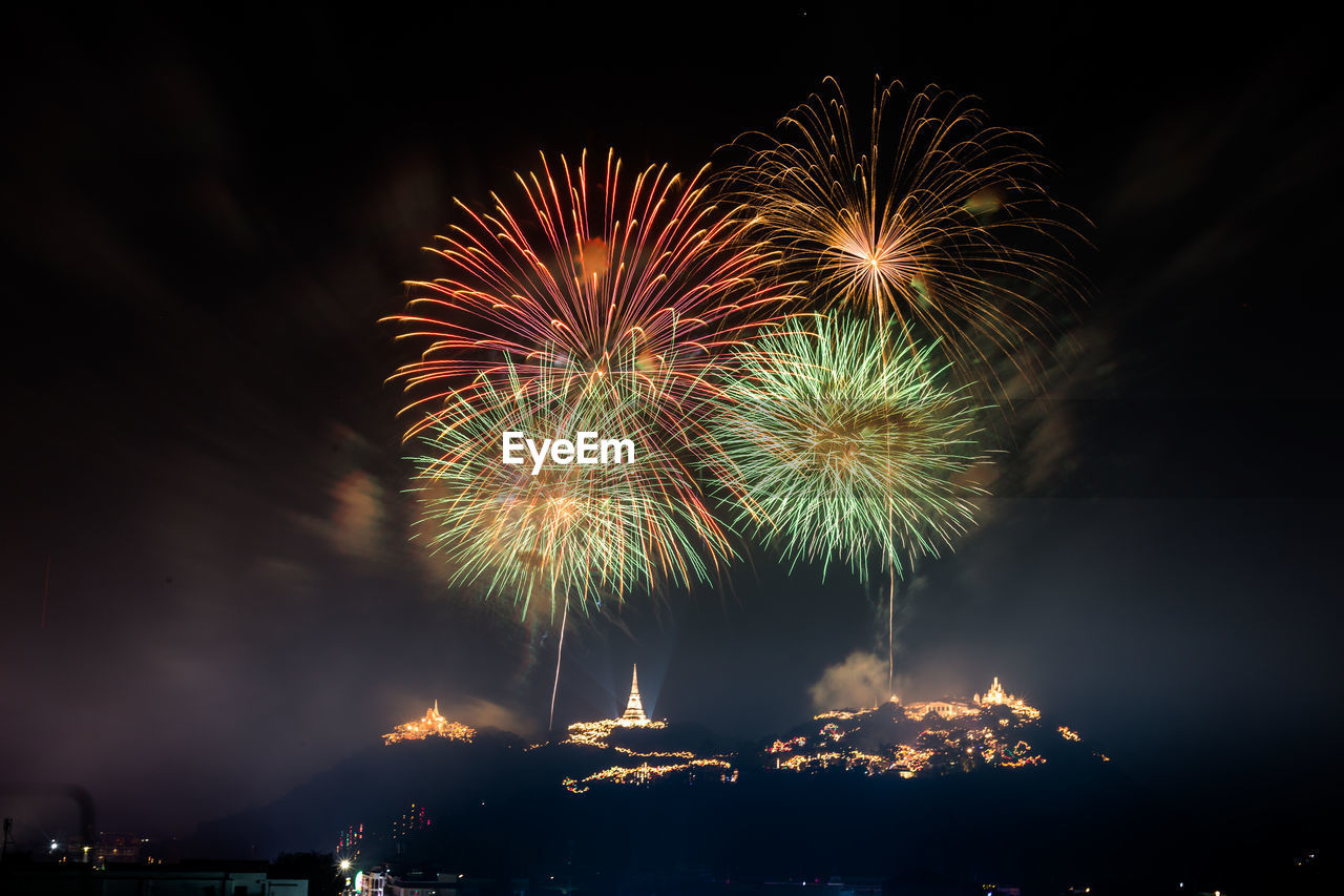 LOW ANGLE VIEW OF FIREWORK DISPLAY IN SKY