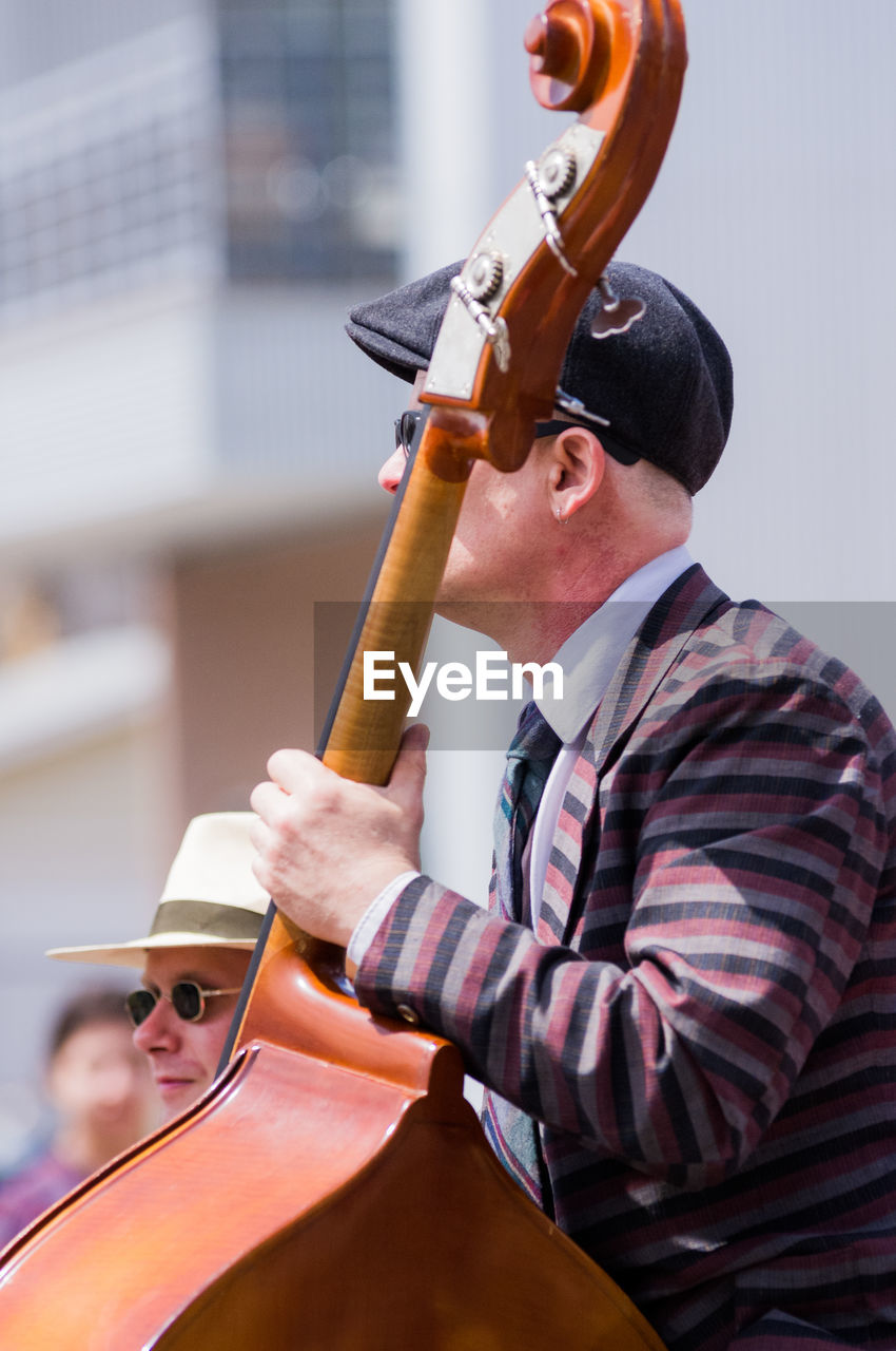 MAN HOLDING MUSIC