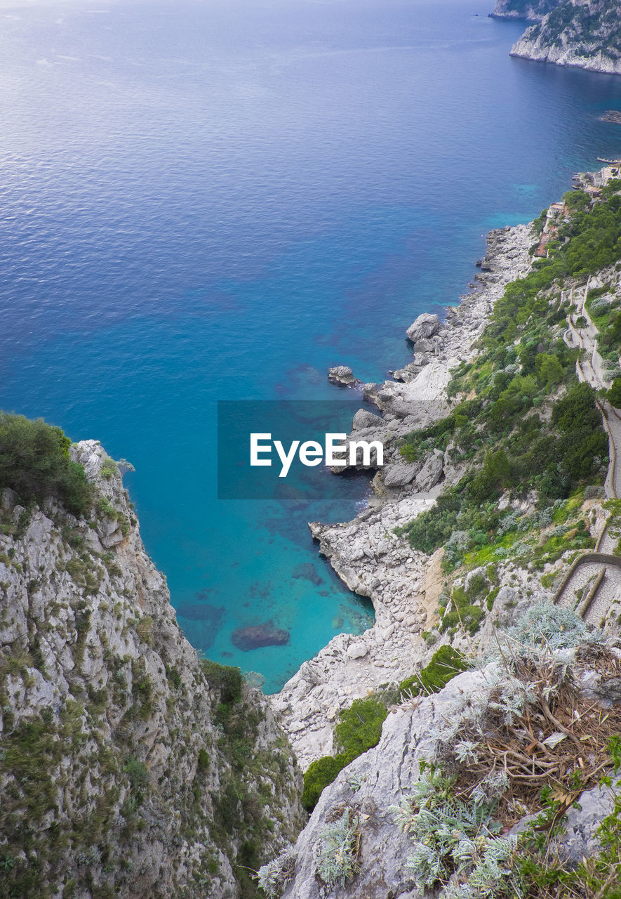 High angle view of rocks and sea