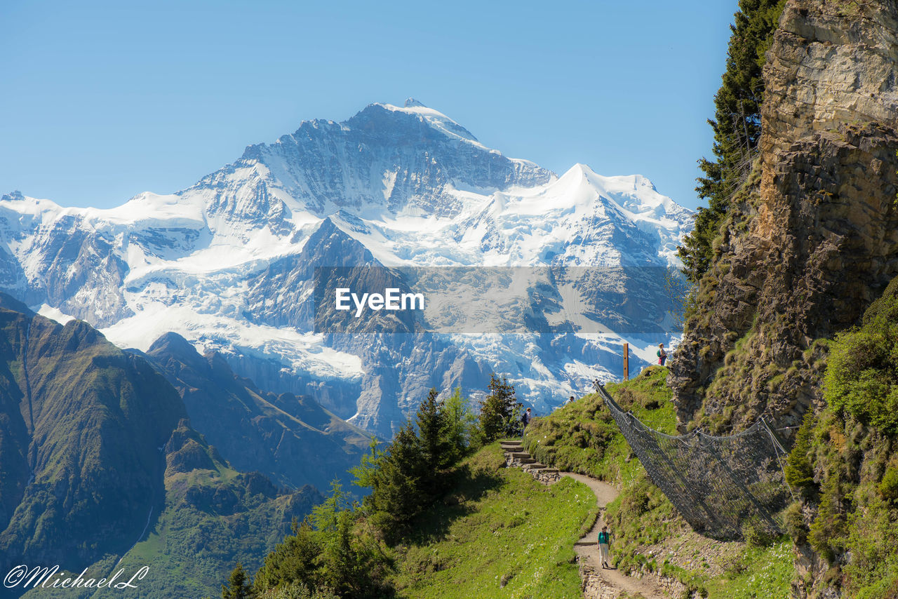 SCENIC VIEW OF MOUNTAINS AGAINST CLEAR SKY