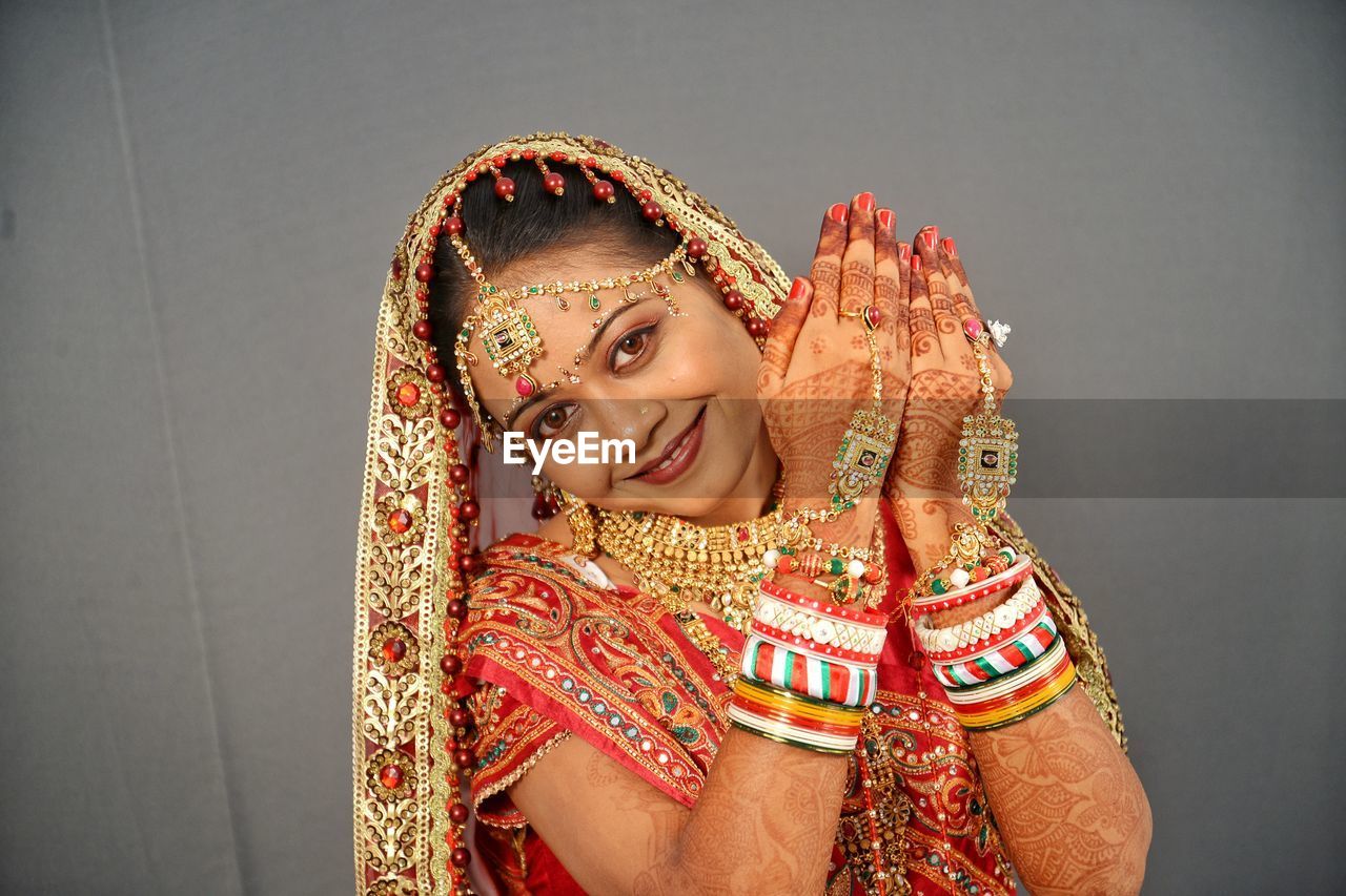 Close-up portrait of smiling young bride at home 