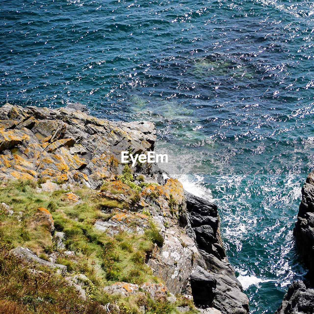 Scenic view of sea by rock formation