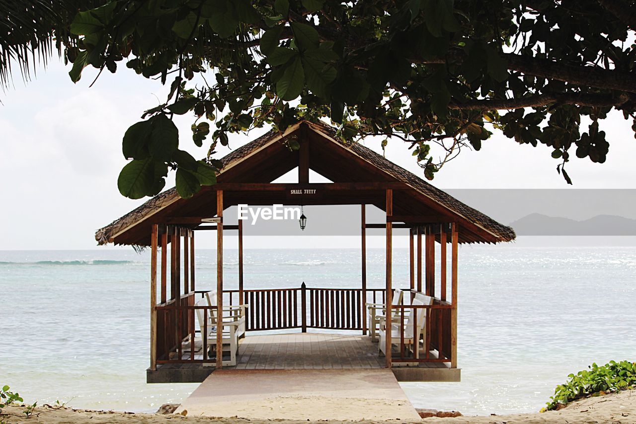 VIEW OF GAZEBO ON BEACH AGAINST SKY