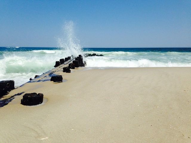 WAVES SPLASHING ON BEACH