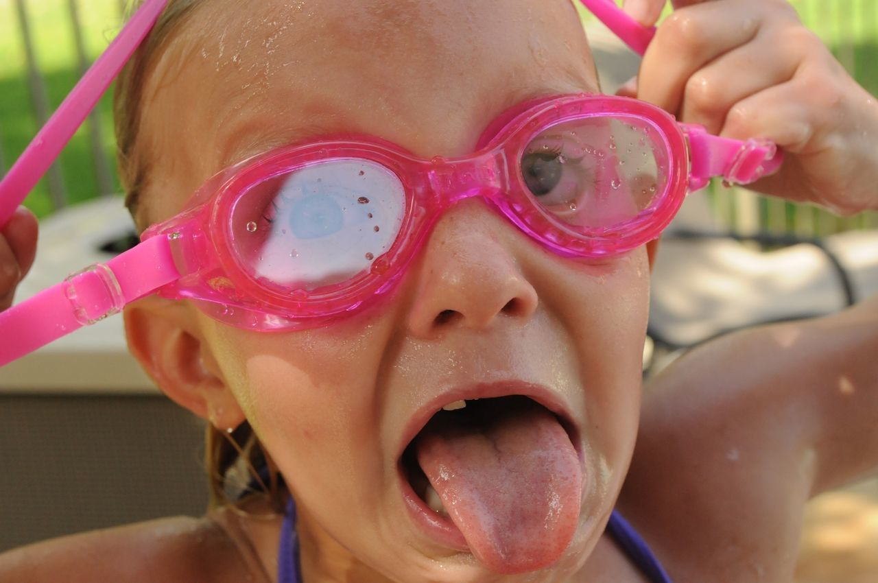 Close-up of girl wearing swimming goggles