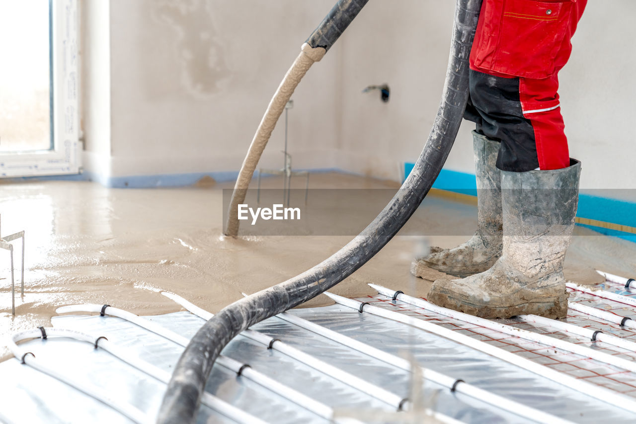 low section of man working on boat