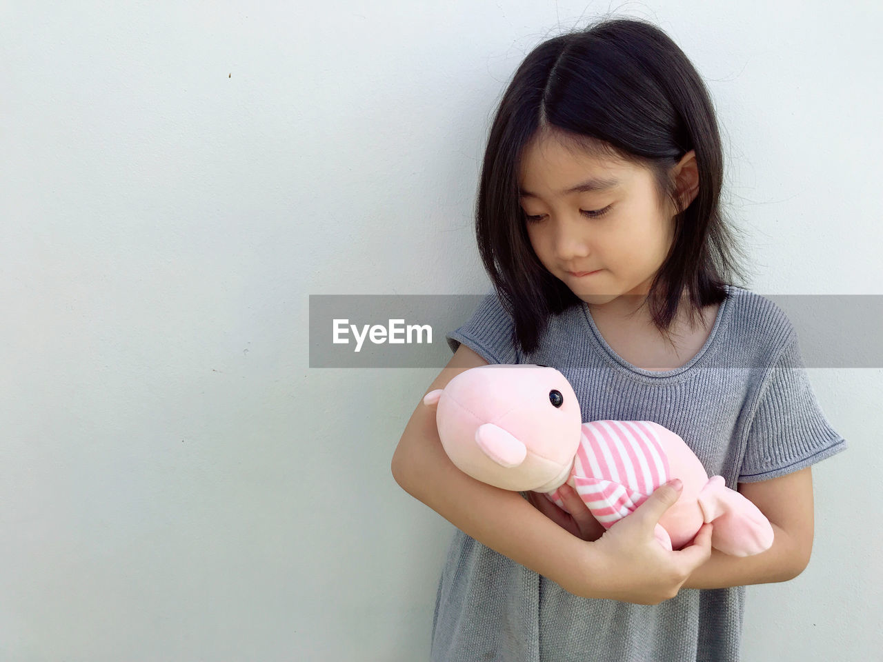 childhood, one person, child, piggy bank, holding, savings, women, pink, indoors, investment, finance, female, human head, front view, person, copy space, nose, black hair, casual clothing, smiling, currency, egg, waist up, emotion, hand, portrait, cute, skin, studio shot, happiness, animal representation, looking, hairstyle, innocence, business, long hair, coin, toy