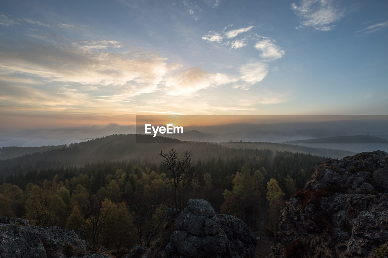 Scenic view of mountains against sky during sunset