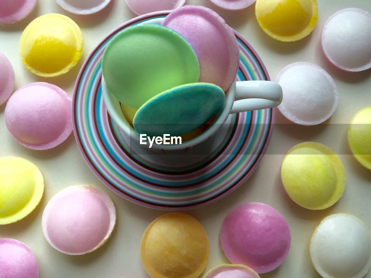 High angle view of flying saucer candies on table