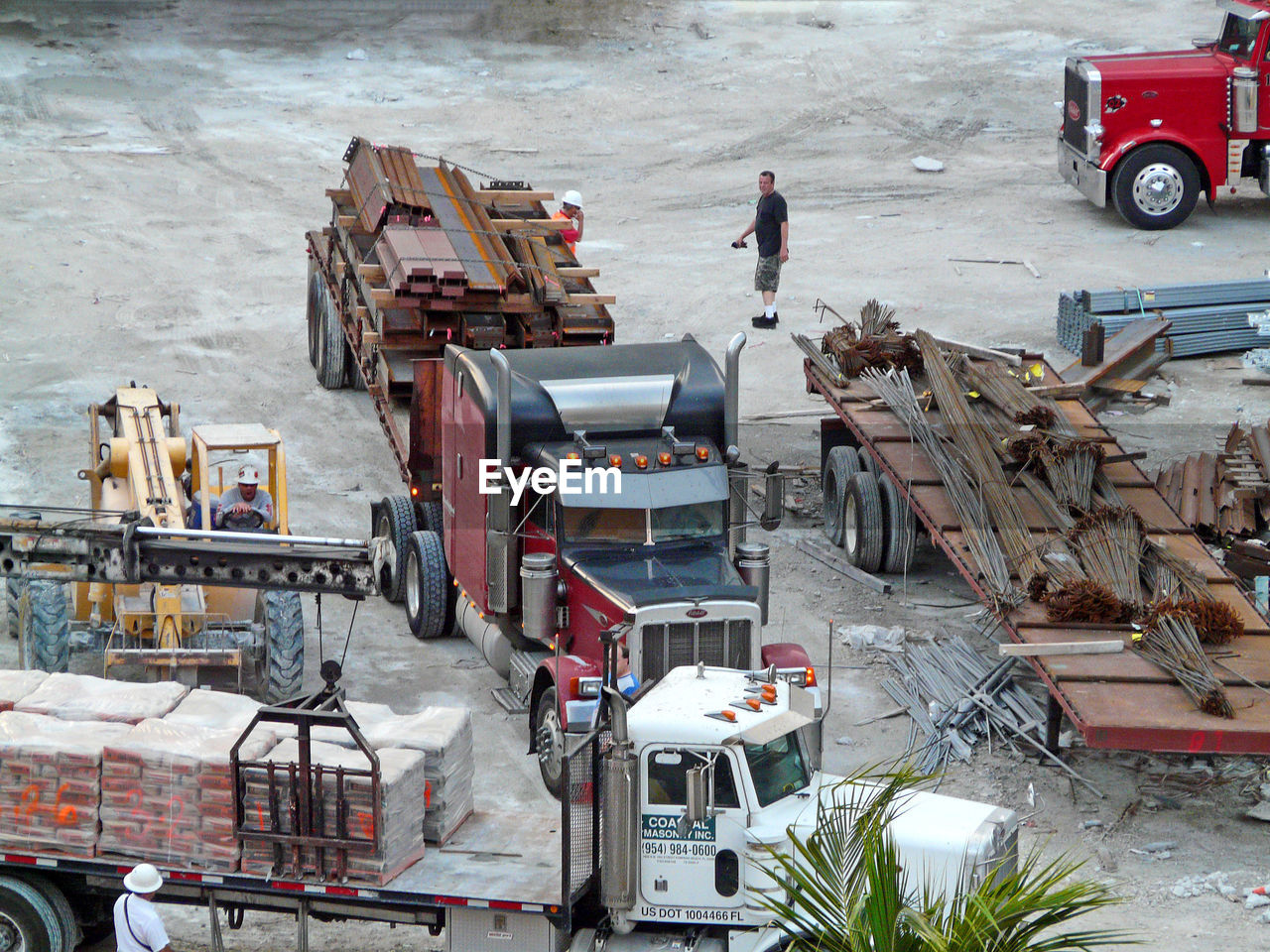 HIGH ANGLE VIEW OF MAN WORKING AT BUS