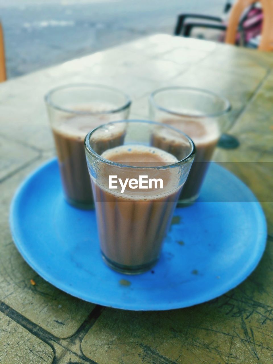 CLOSE-UP OF COFFEE CUP ON TABLE