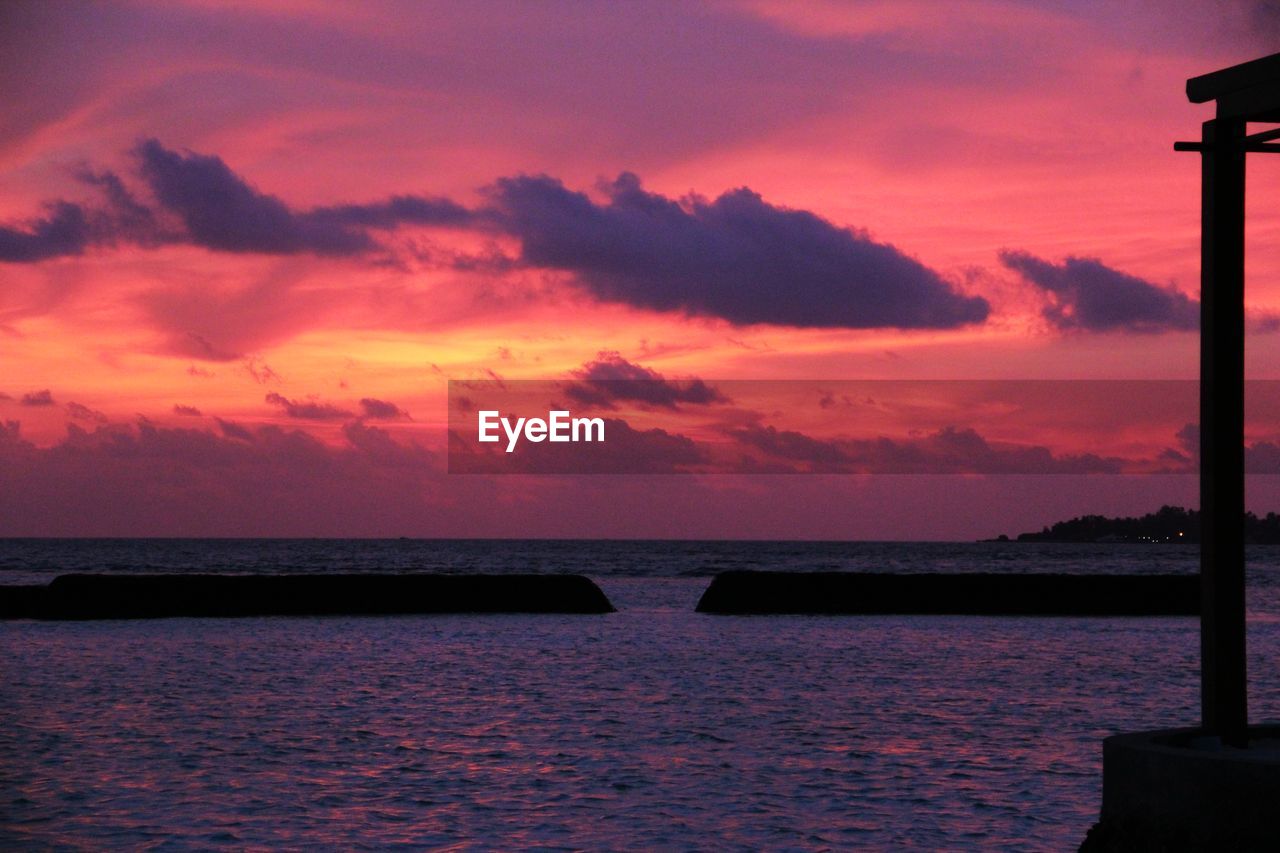 SCENIC VIEW OF SEA AGAINST ROMANTIC SKY