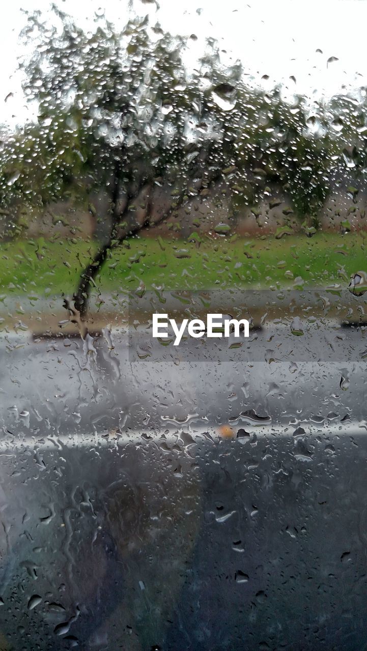 CLOSE-UP OF RAINDROPS ON WINDOW