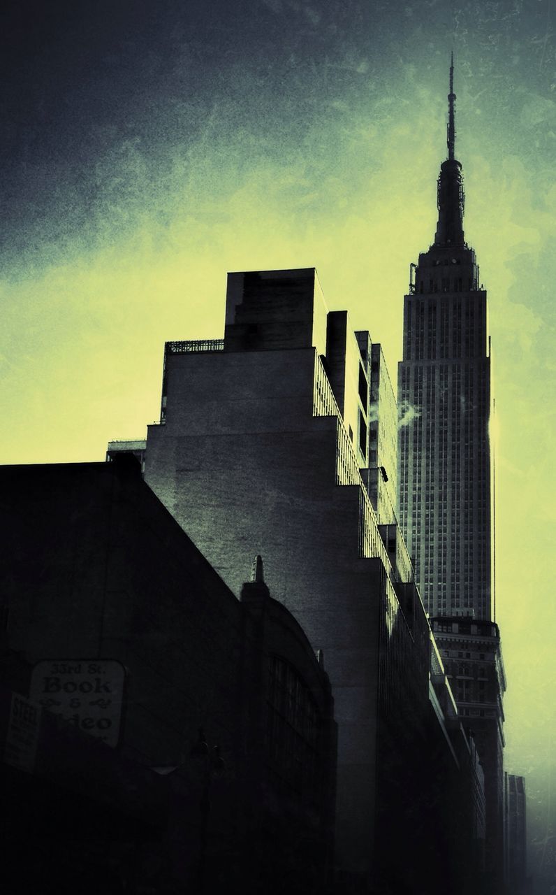 Low angle view of empire state building against sky