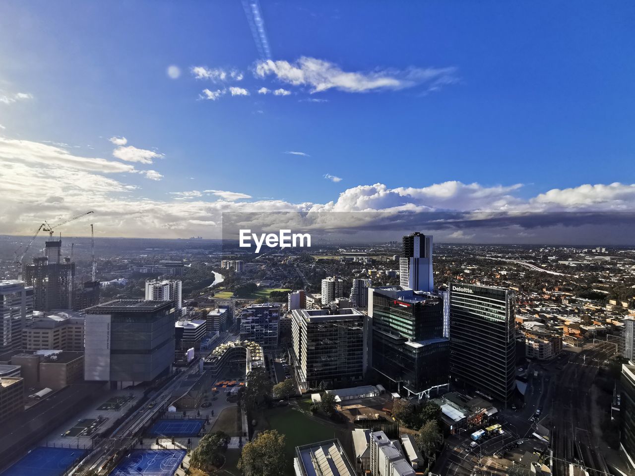 HIGH ANGLE VIEW OF MODERN BUILDINGS AGAINST SKY