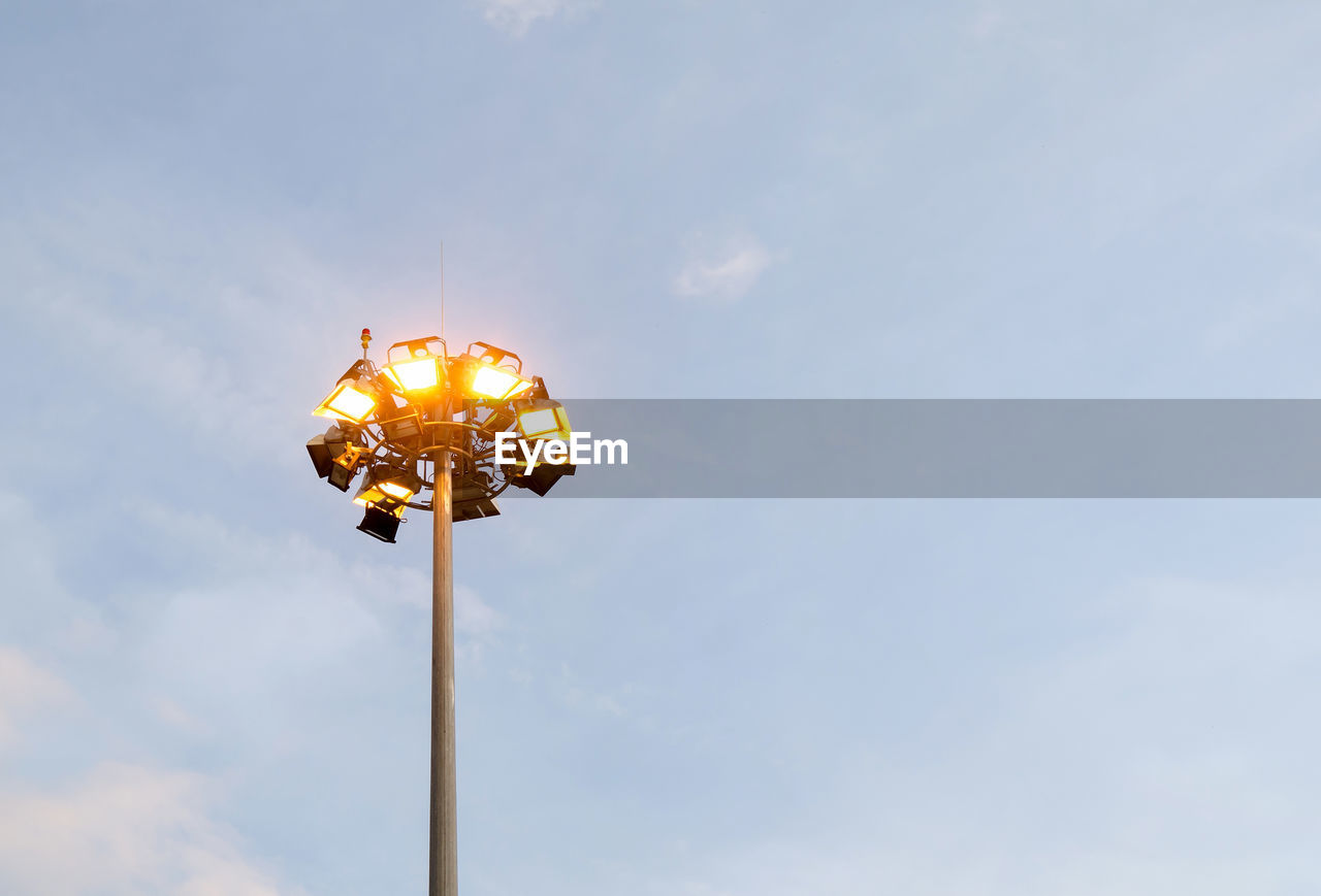 Low angle view of floodlight against sky