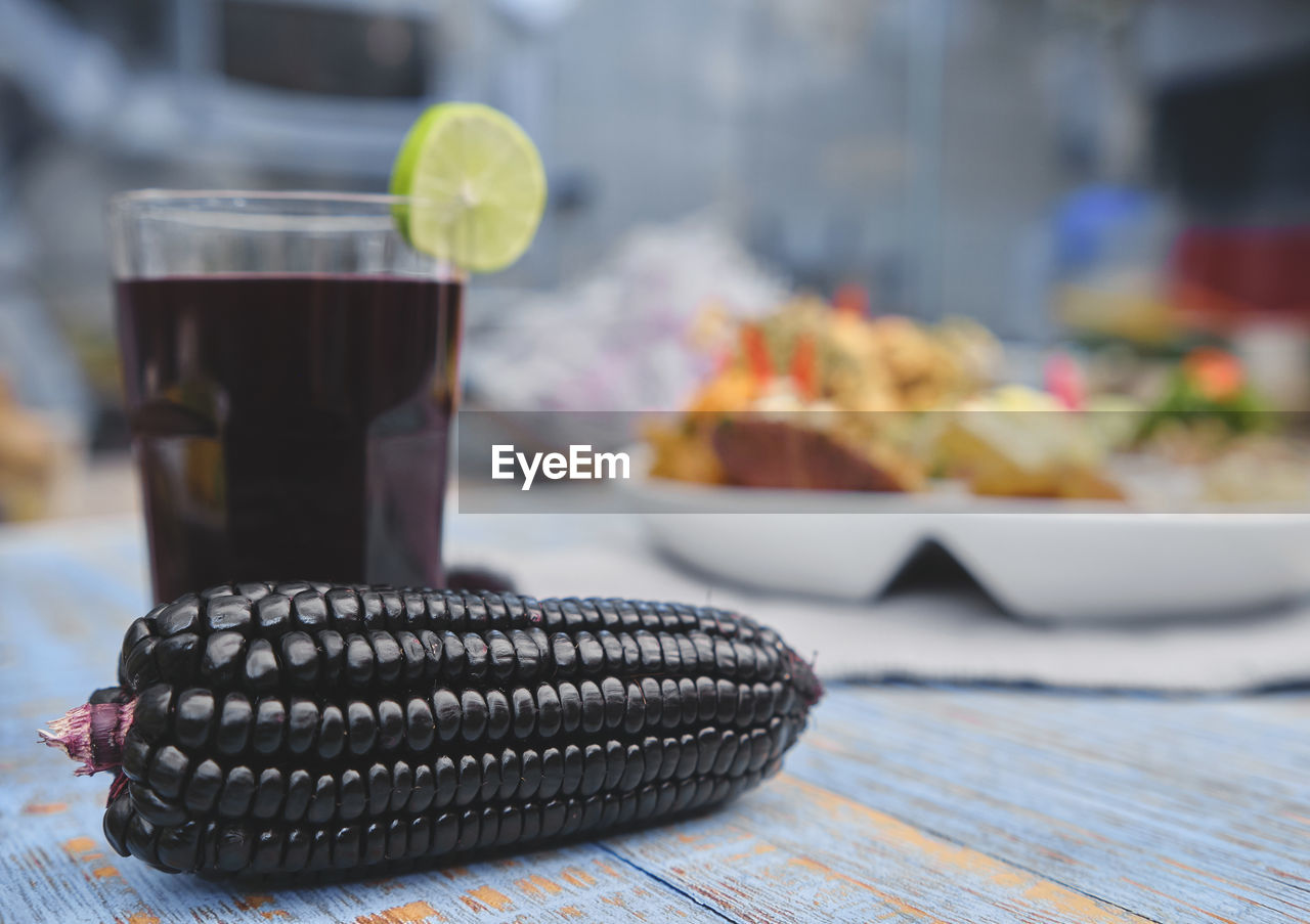 CLOSE-UP OF DRINK SERVED ON TABLE AT HOME