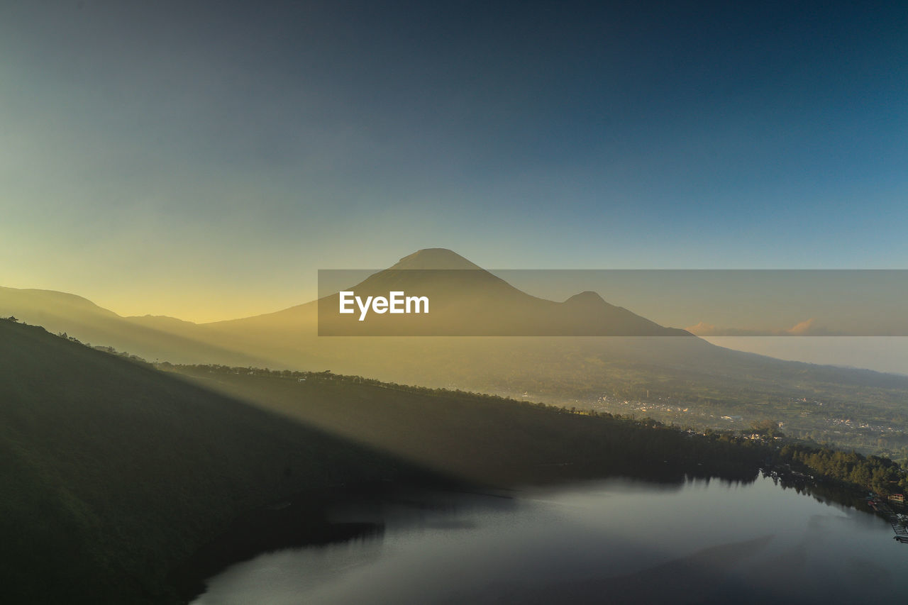 Scenic view of mountains against sky during sunset