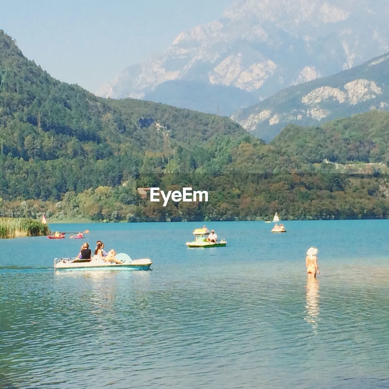 SCENIC VIEW OF BOATS MOORED IN SEA