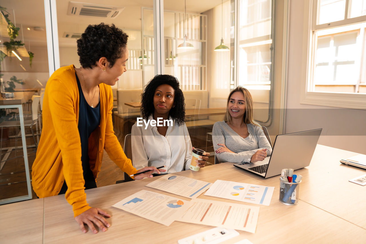 Business colleagues having discussion at office