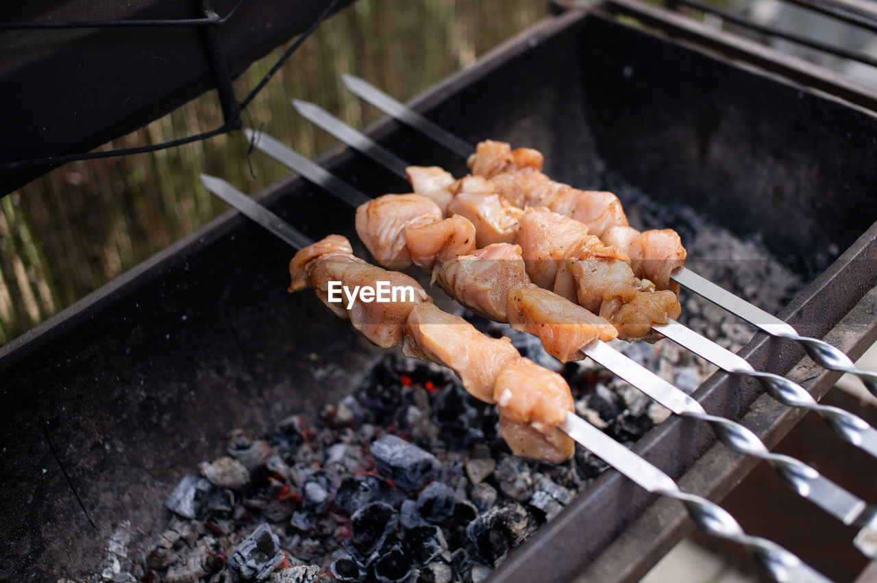 Close-up of meat on barbecue grill