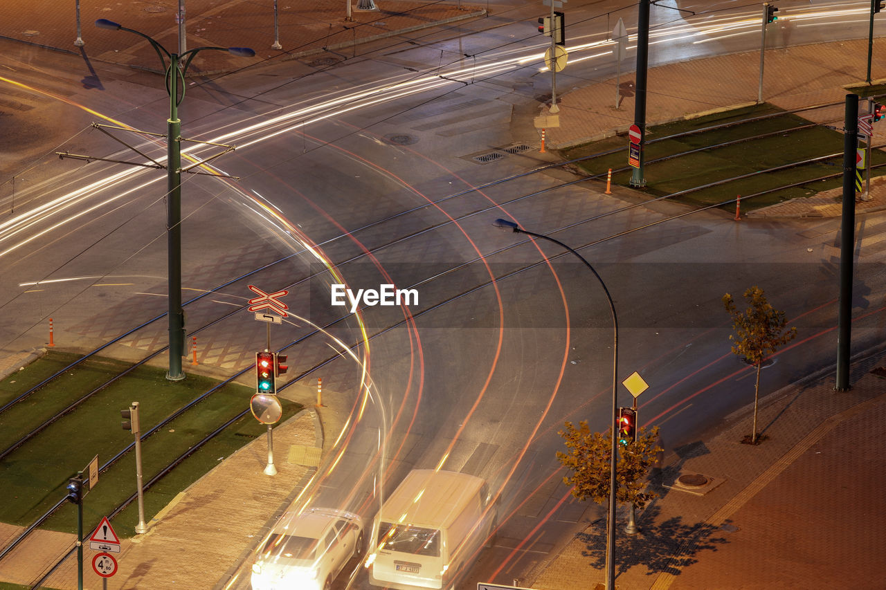 HIGH ANGLE VIEW OF PEOPLE WALKING ON STREET