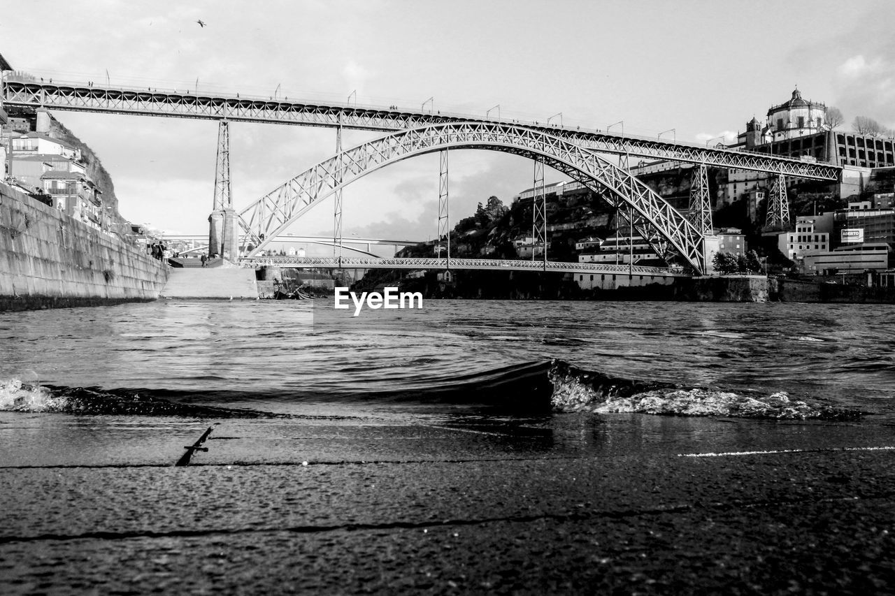 BRIDGE OVER RIVER AGAINST SKY