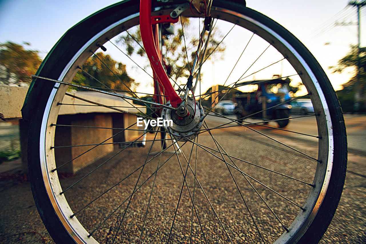 City road through the bicycle wheel