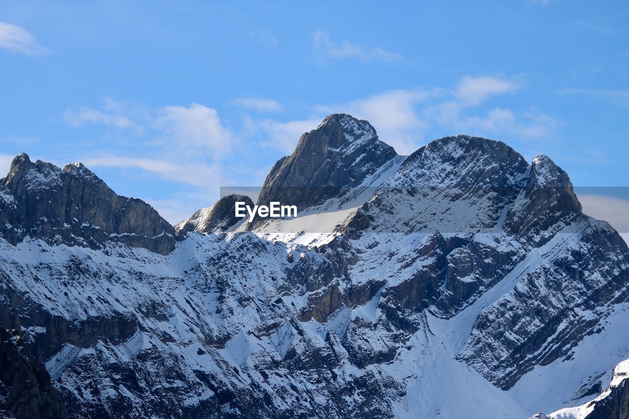 panoramic view of snowcapped mountains against sky