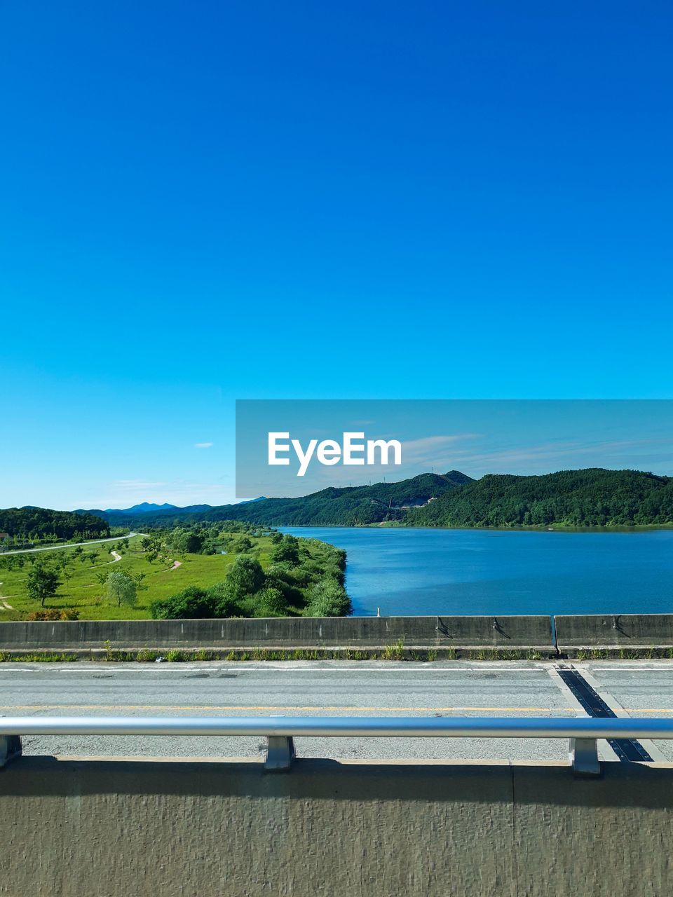 Scenic view of swimming pool against clear blue sky