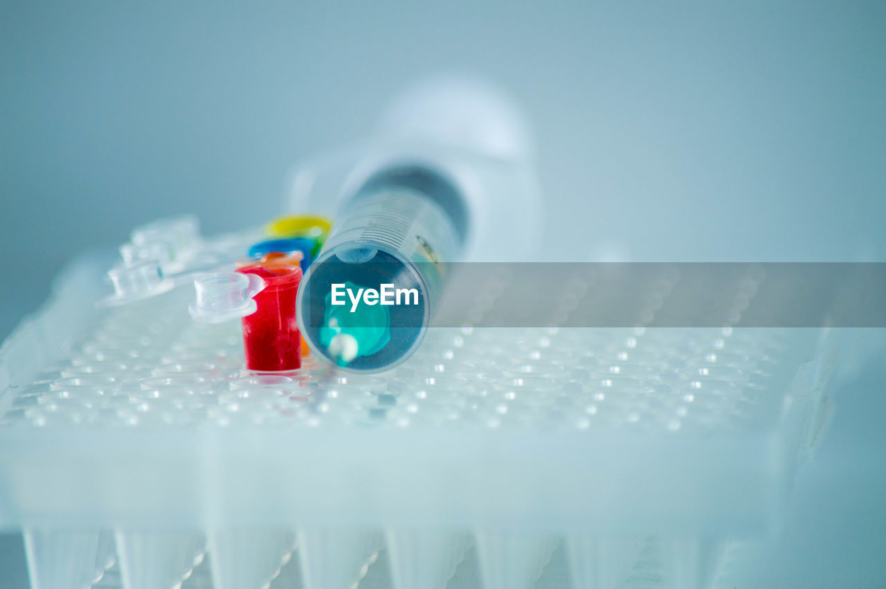 healthcare and medicine, science, research, blue, indoors, studio shot, scientific experiment, no people, laboratory, white, medicine, close-up, biochemistry, test tube, bottle, copy space, medical research