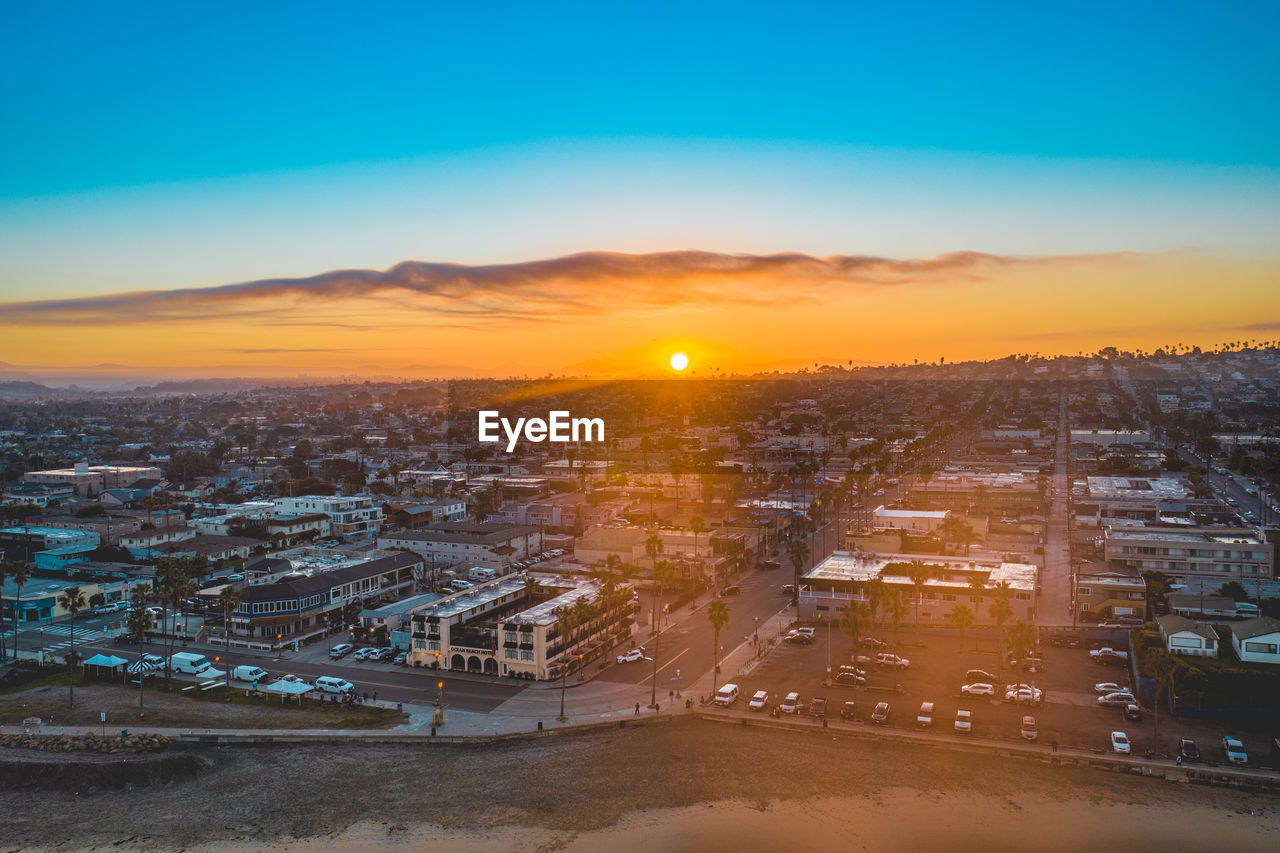 High angle view of illuminated buildings against sky during sunrise in california 