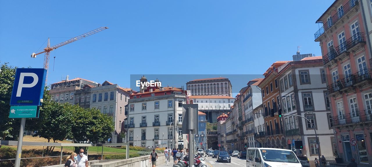 PANORAMIC VIEW OF BUILDINGS IN CITY AGAINST CLEAR SKY