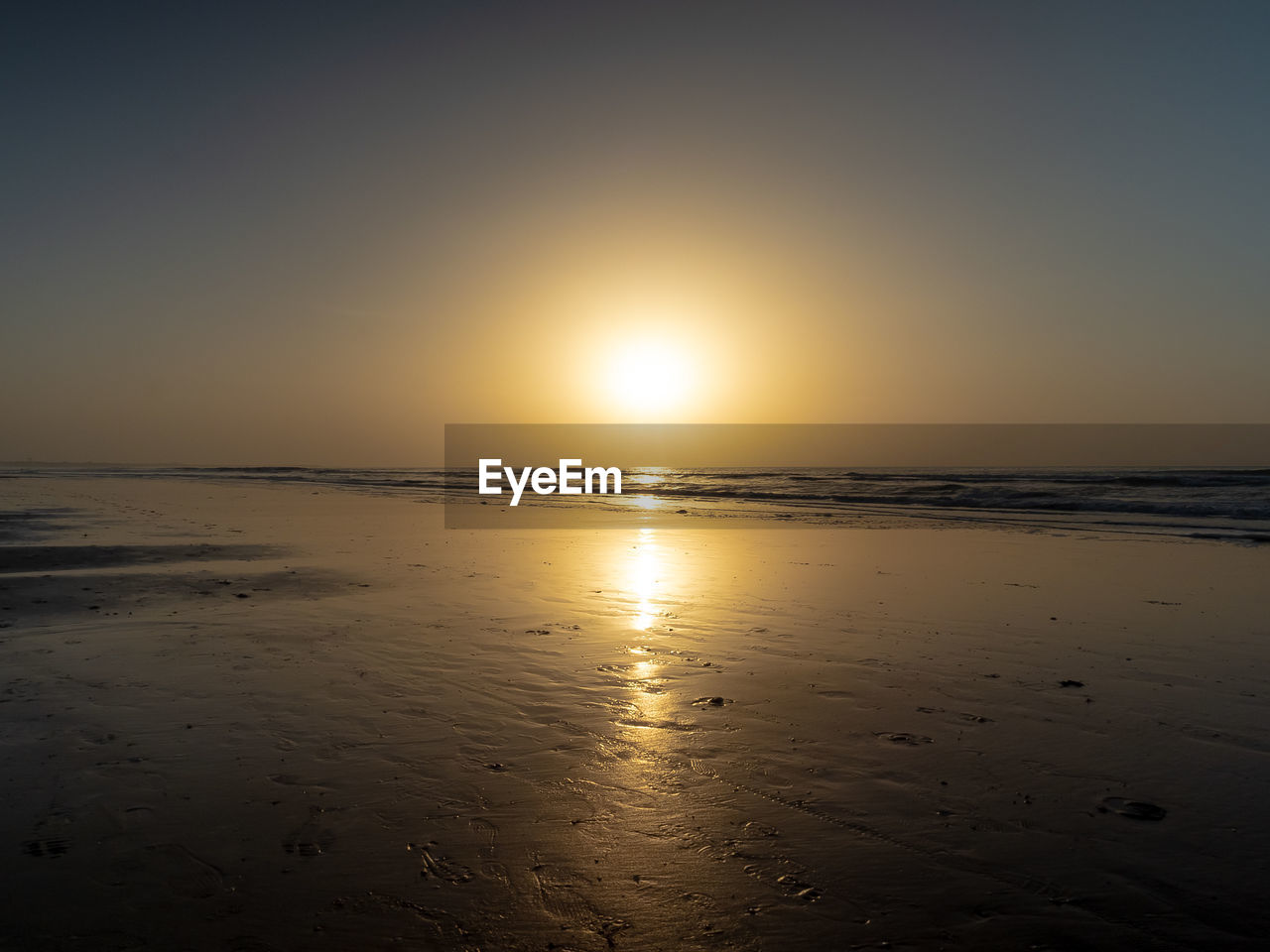 SCENIC VIEW OF SUNSET OVER SEA