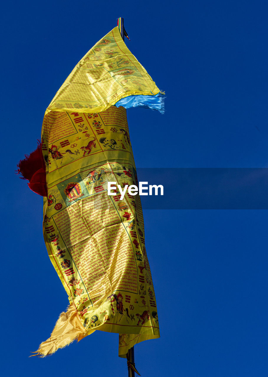 yellow, blue, sky, nature, no people, clear sky, outdoors, sunny, day, leaf, low angle view, tradition